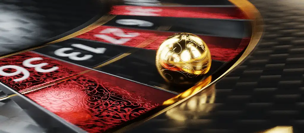 Rulettasztalon gurul&oacute; arany goly&oacute; mozg&aacute;s k&ouml;zben, amely a martingale strat&eacute;gia alkalmaz&aacute;s&aacute;t mutatja be rulett j&aacute;t&eacute;k sor&aacute;n kaszin&oacute; k&ouml;rnyezetben